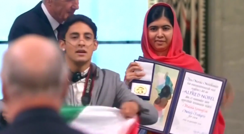 Mexican student Adan Cortes jumped onstage when the Pakistani teenager Malala Yousafzai was collecting her Nobel peace prize. Screenshot from YouTube Video.