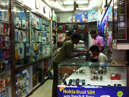Mobile phone shop in Mumbai. Photo by Victorgrigas via Wikimedia (CC BY-SA 3.0)
