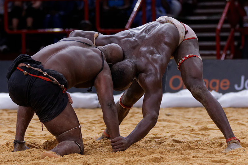 Professional wresting known as Laamb in Senegal is more popular than football. Photo released under Creative Commons by Wikipedia user Pierre-Yves Beaudouin.