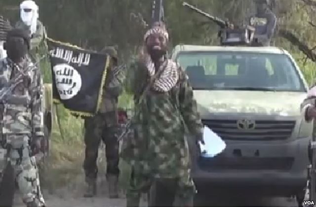 A screenshot from a propaganda video showing Boko Haram leader Abubakar Shekau. Public Domain photo from Voice of America. 