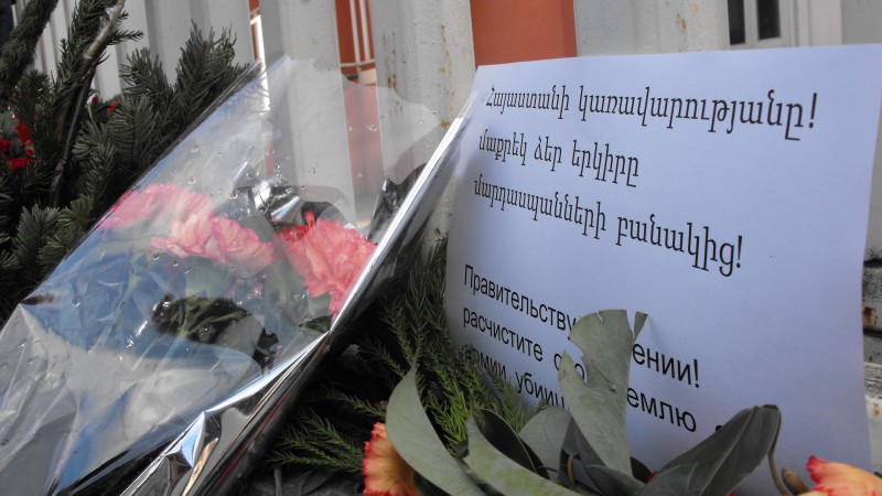 One sign placed outside the embassy read "“Government of Armenia: Rid your country of an army of killers” in Armenian and Russian. 