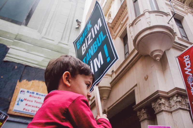 A child carries a banner at the Emek Movie Theater Protest on April 5, 2014. Photo by Görkem Keser. Demotix ID: 4396772. 