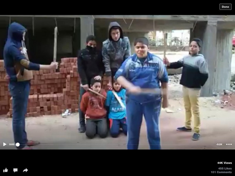 Children in Mahalla, Cairo, role-playing the ISIS and "slaughter" other children ISIS-style. Photograph from a video shared by @Shokair on Twitter