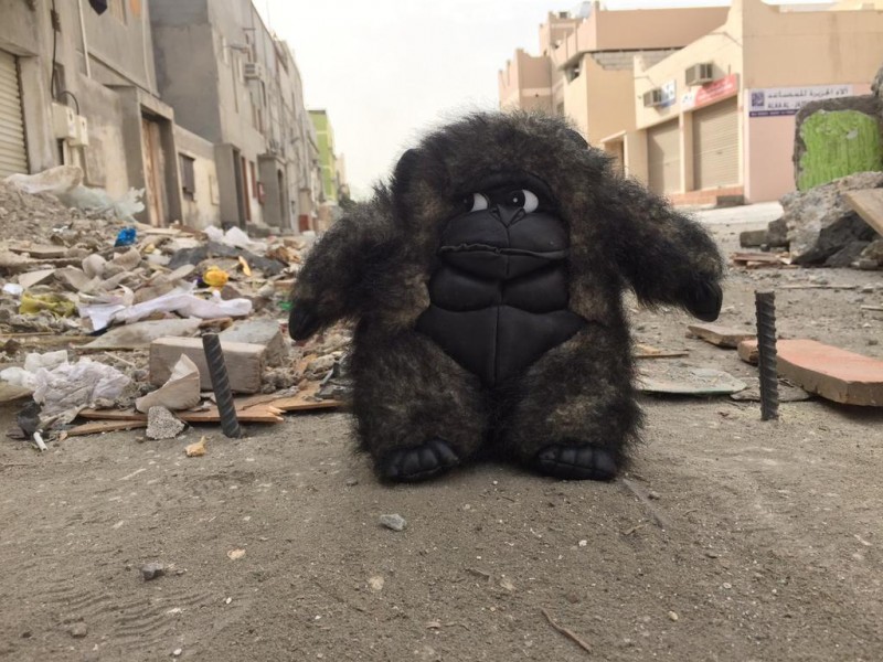 A giant Godzilla-like ape appears to guard a makeshift barricade put up by protesters in Bahrain today. Barricades made out of debris, construction material, plants and rubbish are erected by protesters on roads leading to protest spots to stall the riot police from attacking the protesters in full force. Source: Unknown