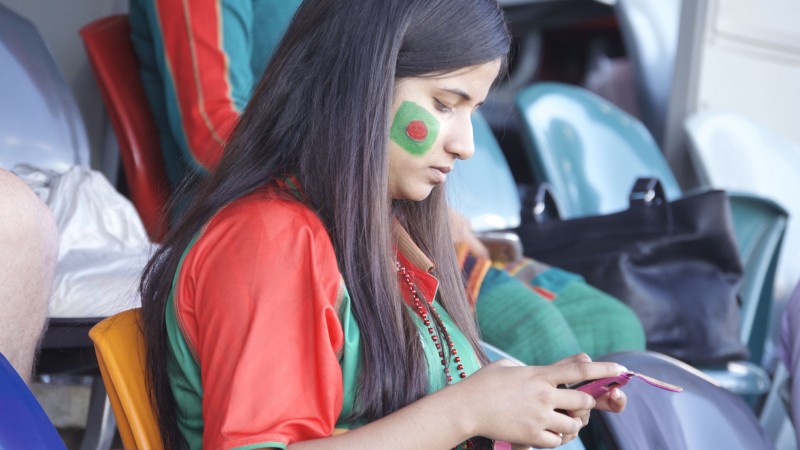 Bangladeshi supporters wore the green and red team jerseys which bore the colors of the Bangladeshi flag. Image by Rezwan