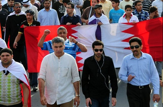 Abdulemam (center) walks in a protest march with Nabeel Rajab (left) and Abdulhadi Al-Khawaja. Photo by Mohamed CJ via Wikimedia (CC BY-SA 3.0)