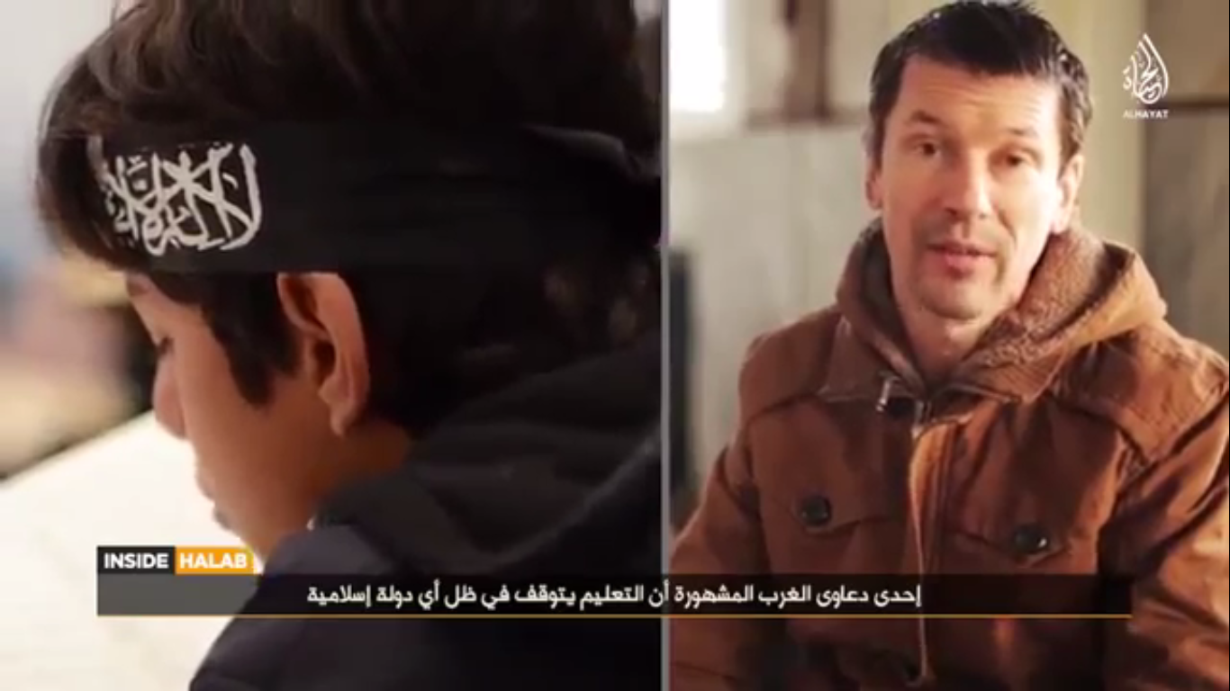 A screen-shot of the latest IS propaganda video, highlighting British hostage John Cantlie as its reporter.