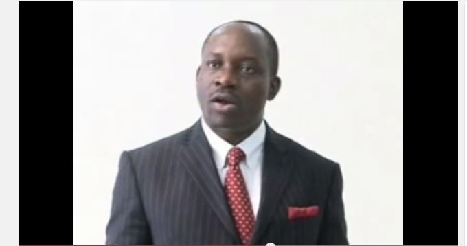 A screenshot of a YouTube video of Chukwuma Soludo addressing members of the press in 2009.