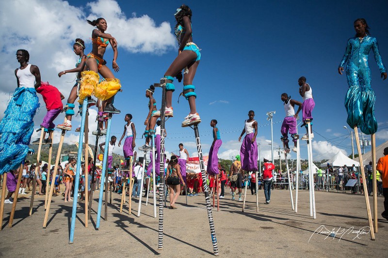 Moko Jumbies (stilt walkers) en masse. Photo by Quinten Questel, used under a CC BY-NC-ND 2.0 license. 