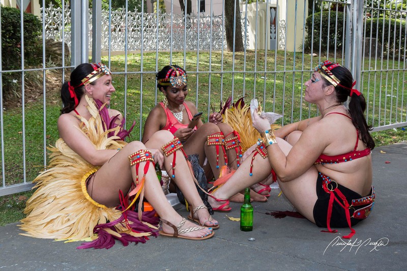Friends take a break during the street parade. Photo by Quinten Questel, used under a CC BY-NC-ND 2.0 license.  