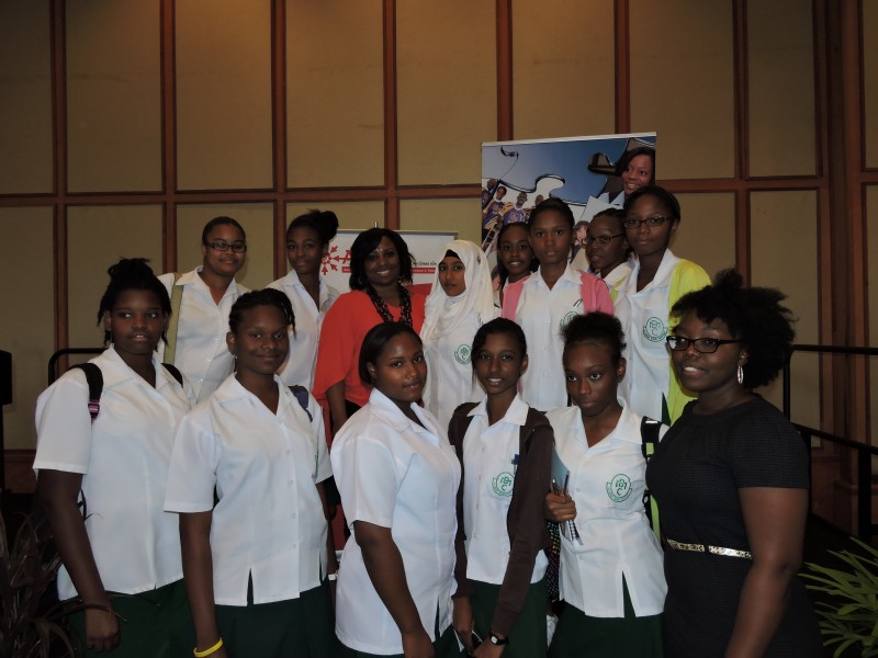 Dr. Camille Wardrop-Alleyne poses with secondary school students in Trinidad. Photo by Dawn Lafond, used with permission. 