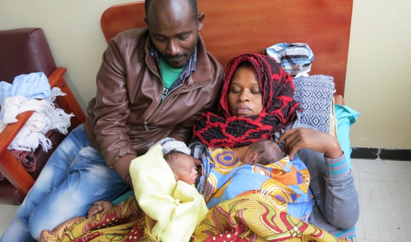 At a hospital in Ethiopia's capital, Wandamu and his wife Lakish have been in practicing kangaroo care for nearly three weeks. Their heavier, healthier twin, can now sleep on his own and is breast feeding healthily. The smaller twin is still in the "kangaroo" position on his mom's chest. Credit: Dalia Mortada