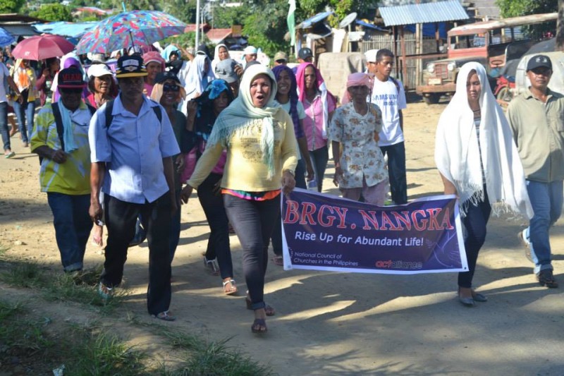 During the 'walk for justice', residents carried banners which read 'rise up for abundant life'.