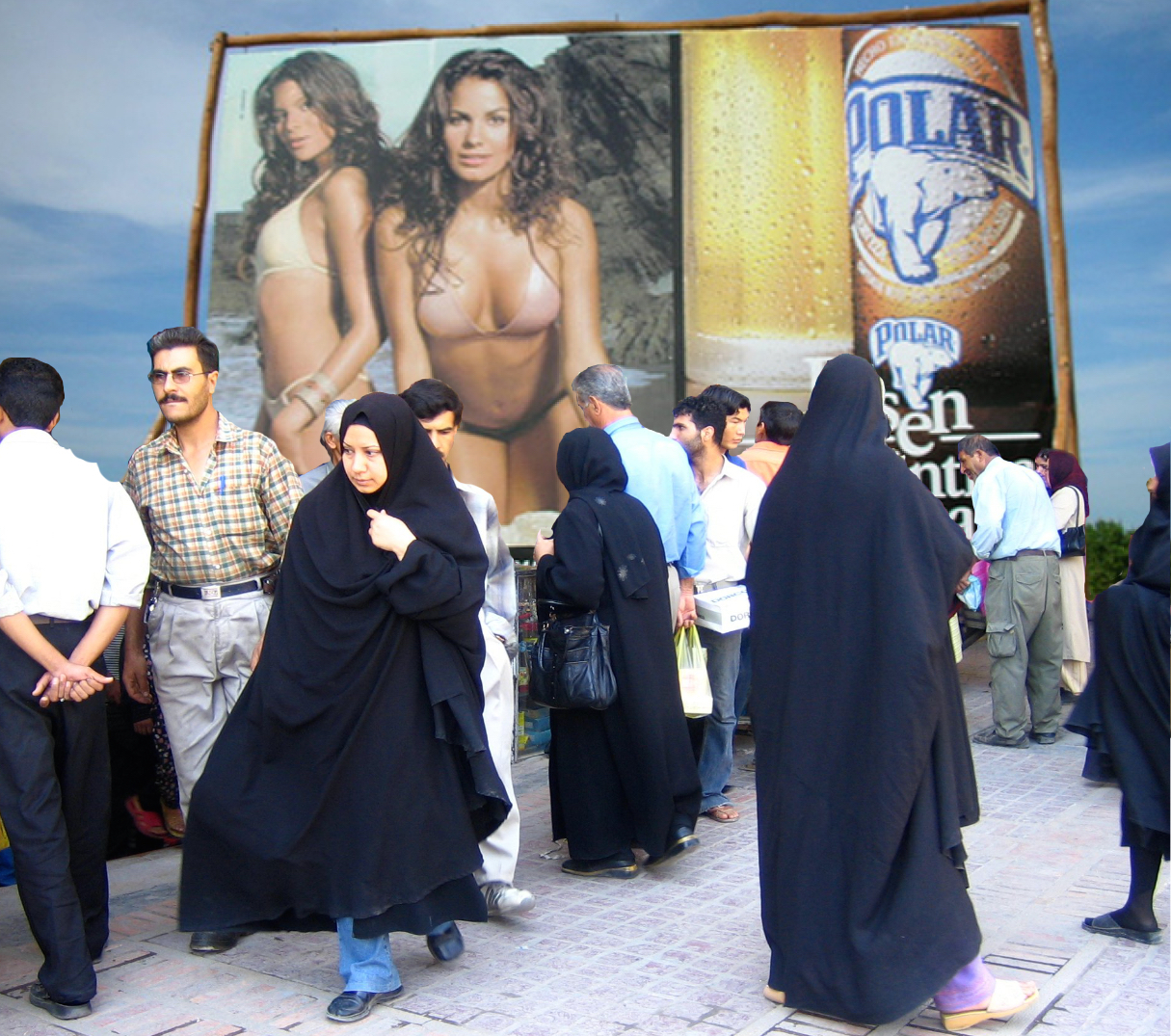 Bikinis vs Chadors in Venezuela and Iran: "After acclimatizing to Venezuela, even some of the Iranian women would adopt the more revealing dress style of their Venezuelan peers." Shiraz street scene photo by Flickr user Gabriel White (CC BY-SA 2.0). Images remixed by Georgia Popplewell.
