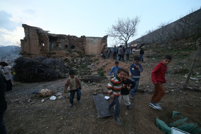 Kurdish children play in the ruins of an Armenian church in Bitlis. Photo by John Lubbock. 