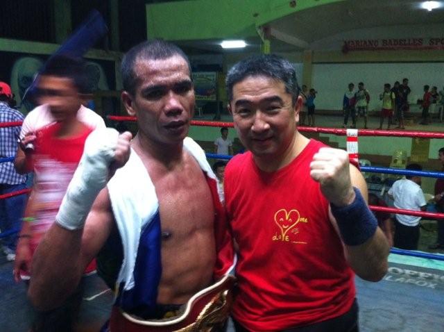 Japanese trainor Eiji Yoshikawa (right) and Cirilo Espino (left) who won a boxing championship in Mindanao Island in the Philippines