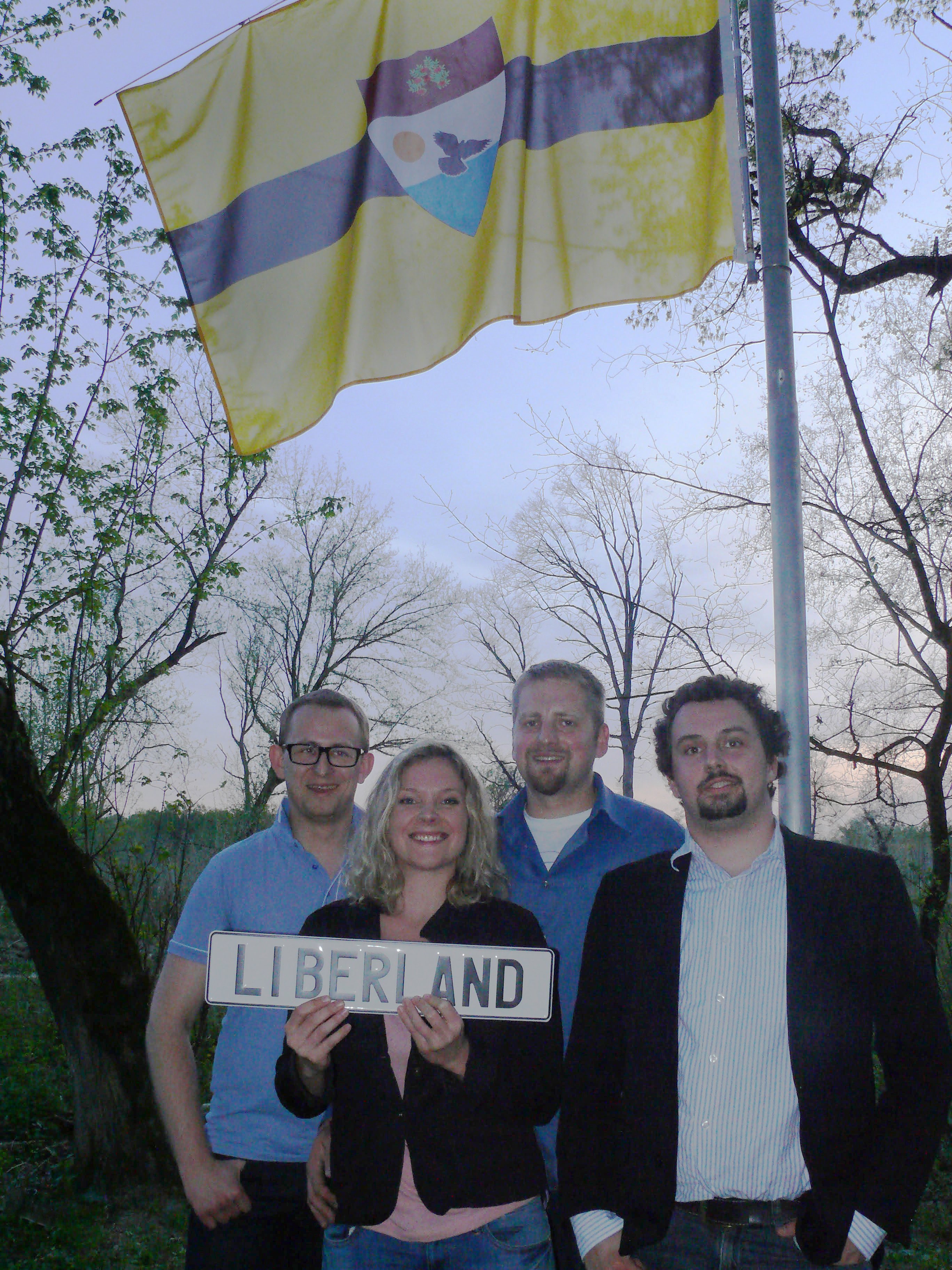 Some of the founders of Liberland, upon planting the country's flag on the territory between Croatia and Serbia. Photo from Liberland.org official press release. 