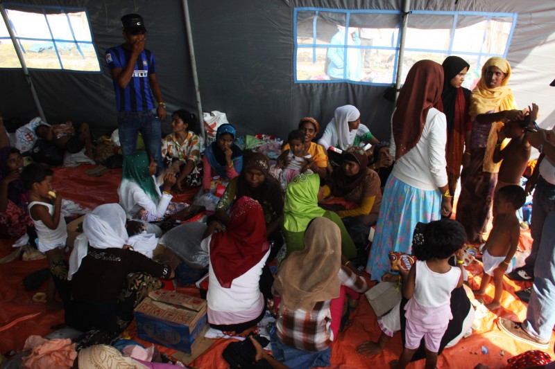 Immigrants from Myanmar and Bangladesh arrive in Langsa, East Aceh in Indonesia. At least 678 immigrants arrived on boats in poor health. Photo by Dodi Kurniawan, Copyright @Demotix (5/16/2015)