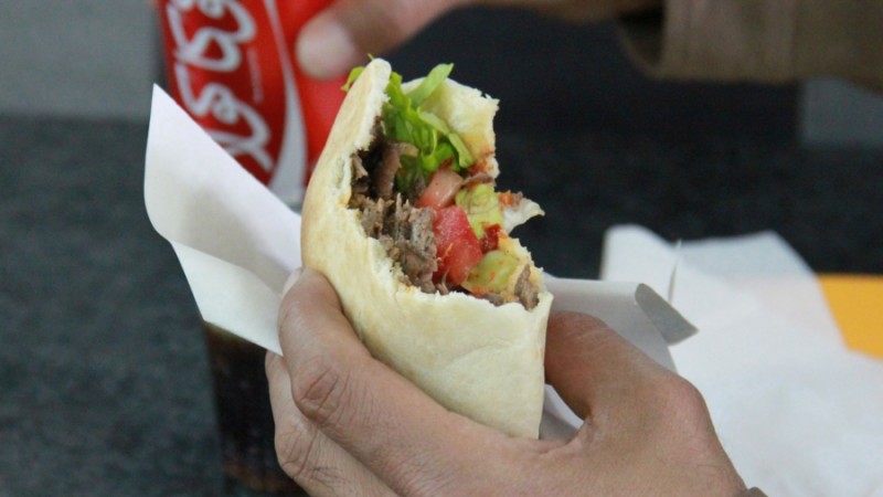 A shawarma sandwich in Jerusalem. Swap in pork for lamb, and a tortilla for a pita, and you've got the Mexican classic, Taco al Pastor. Credit: Daniel Estrin. Published with PRI's permission