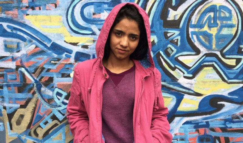 Afghan rapper Sonita Alizadeh narrowly escaped a forced marriage at 14 by writing the song "Brides for Sale." She recently visited West Oakland, California, and was surprised that the US, like Iran and Afghanistan, has poor neighborhoods and homeless people.   Credit: Shuka Kalantari. Published with PRI's permission.