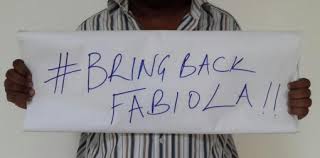 An Unidentified Person Holds Plackard asking NTV to Bring Back Fabiola.