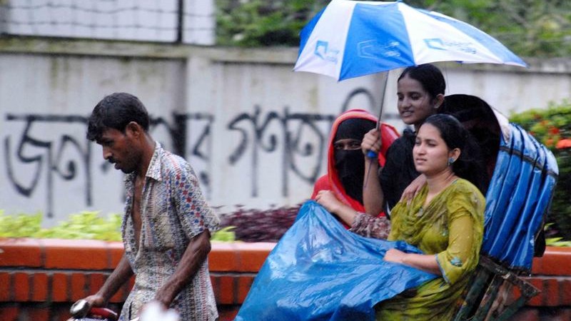 People welcomed the rain that engulfed Dhaka city after the period of hot and humid weather. Image by Bayejid Akter. Copyright Demotix (28/08/2010).