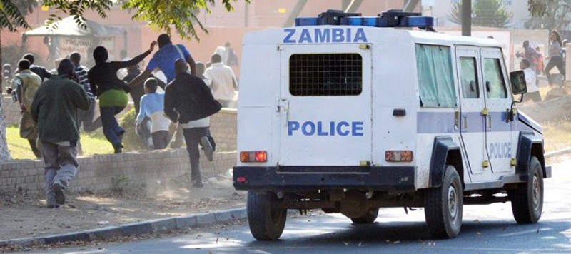 A Zambian police van carrying riot police chasing rioting students at one of the public colleges in Lusaka. Photo used with the permission of Lusaka Times.