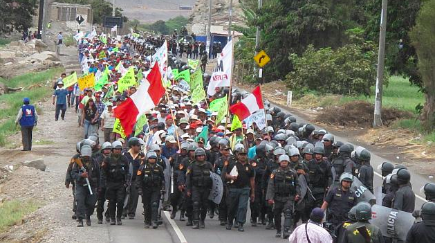Image of one of many manifestations against Tia Maria mining project in Perú strongly watched by peruvian forces of order. Photo taken from the site of peruvian politician Rosa Maria Palacios.
