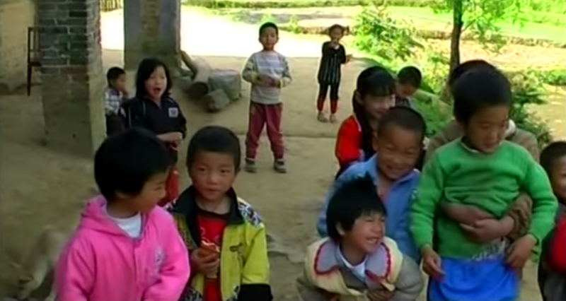 60 million children are left-behind in rural areas while their parents are working in big cities. Screen capture from a documentary on left-behind children directed by Jiang Nengjie