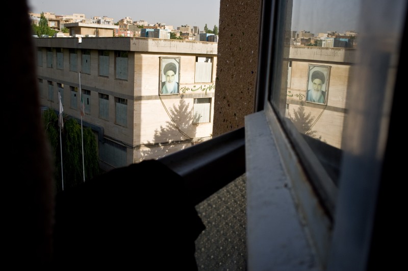The image of the leader of the Iranian Revolution Imam Khomeini on the wall of a building in Sanandaj, in the capital of Iranian Kurdistan Province, as seen through an open window. Photo by Jordi Boixareu. Copyright Demotix