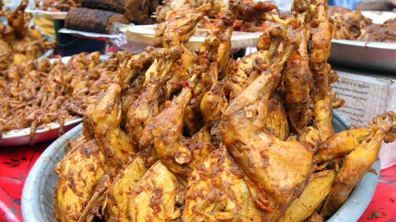 Whole chicken roasts at the Iftar market. Images by SK Hasan Ali. Copyright: Demotix (30/6/2014).