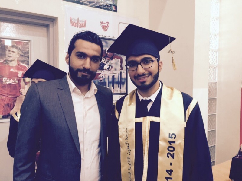 Mustafa Mohammed Ismael, right, with his brother Ali, at his graduation ceremony 