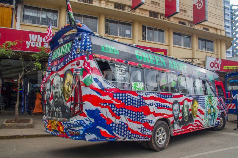 A matatu [local public transport] with American flag colours and the portraits of Abraham Lincoln, Martin Luther King Jr. and President Obama cruising Nairobi streets. Photo by Boniface Muthoni, copyright ©Demotix  (24/7/2015.