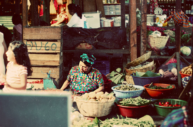 Thomas Frost Jensen Follow Woman in market  Antigua, Guatemala