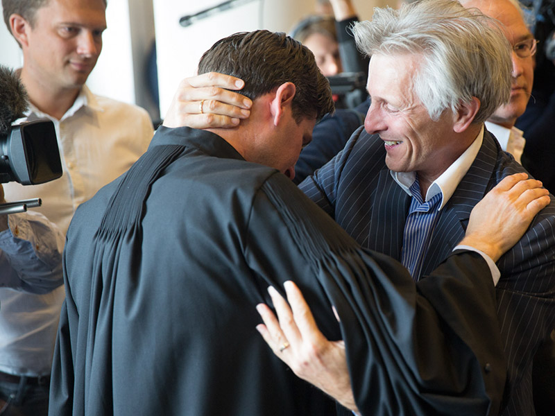 Urgenda lawyer Roger Cox (at left in black robe) after winning the historic Dutch climate case. Photo by Urgenda / Chantal Bekker and republished with permission.