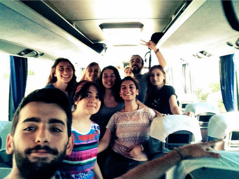 Hatice Ezgi Sadet is in the brown shirt, to the right, as she travels on the bus to Suruç with fellow activists. Credit: Hatice Ezgi Sadet's Instagram.