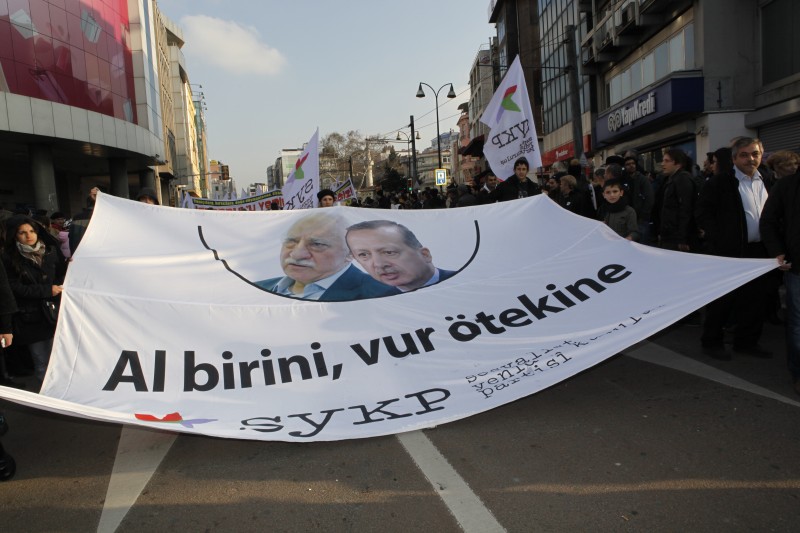 In Istanbul a banner with Fethullah Gulen and PM Erdogan's pictures reads "one is no better than the other". Protesters rally to protest against corruption and planned construction projects. Demotix photo taken by Fulya Atalay. ID 3553279.