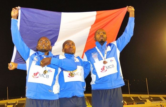 Screen Capture of  athletes from Mayotte raising the French flag at medal ceremony