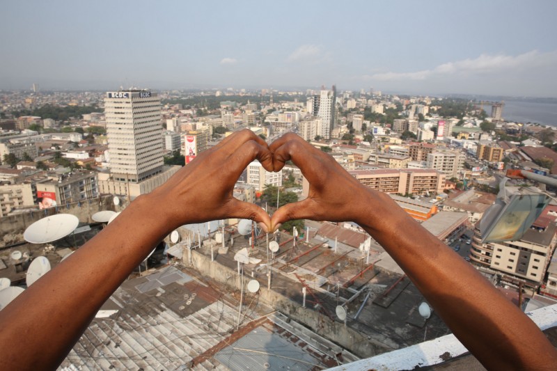 Kinshasa, DR Congo: A woman’s hands make the heart-shaped logo of the World Day of dignity for victims of human trafficking, celebrated on 30 July. Photo by MONUSCO Photos; Photographer: Abel Kavanagh; used under a CC BY-SA 2.0 license. 