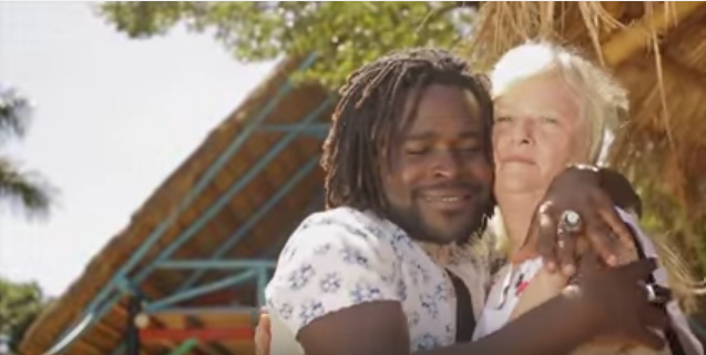 A screenshot of Guvnor Ace with his wife Lisa in a music video of a song titled Old Woman. 